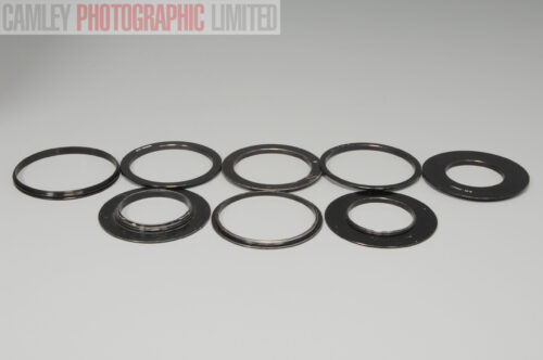 Set of 8 Cokin Filter Adapters. 49 52 B50 58 67 77 88. Graded: EXC- [#10078]
